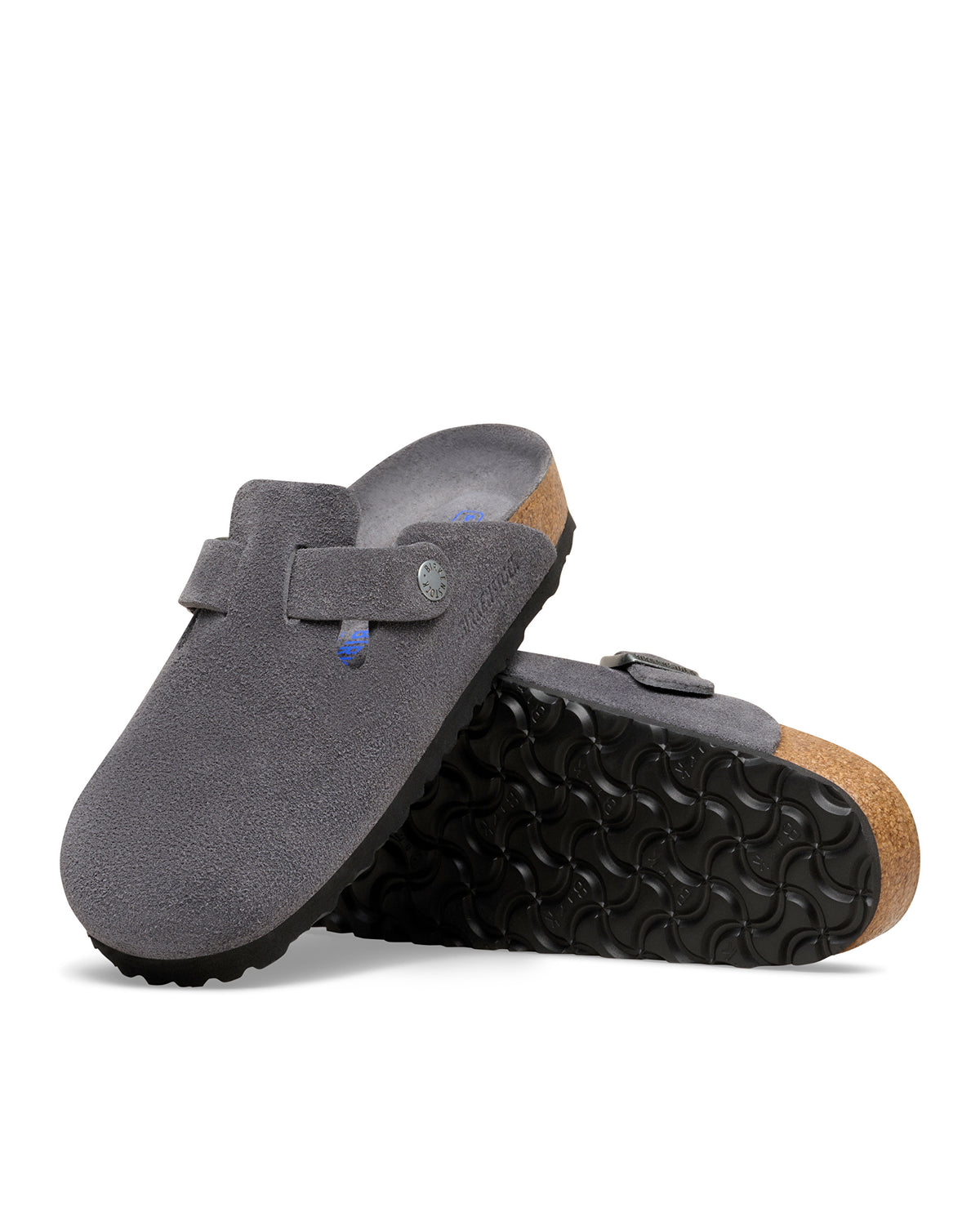 Birkenstock Boston Soft Footbed Suede Leather Clog in Charcoal

The Birkenstock Boston Clog has transitioned from a lounge staple to a street-style icon, and this version offers the most "broken-in" feel right out of the box. Crafted from premium, velvety suede, the upper has a soft, flexible drape that conforms comfortably to the foot. The standout feature is the integrated latex foam layer tucked inside the signature cork footbed. 