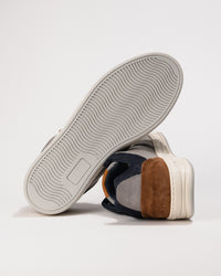 Sneaker with a focus on sole and side view on a light background