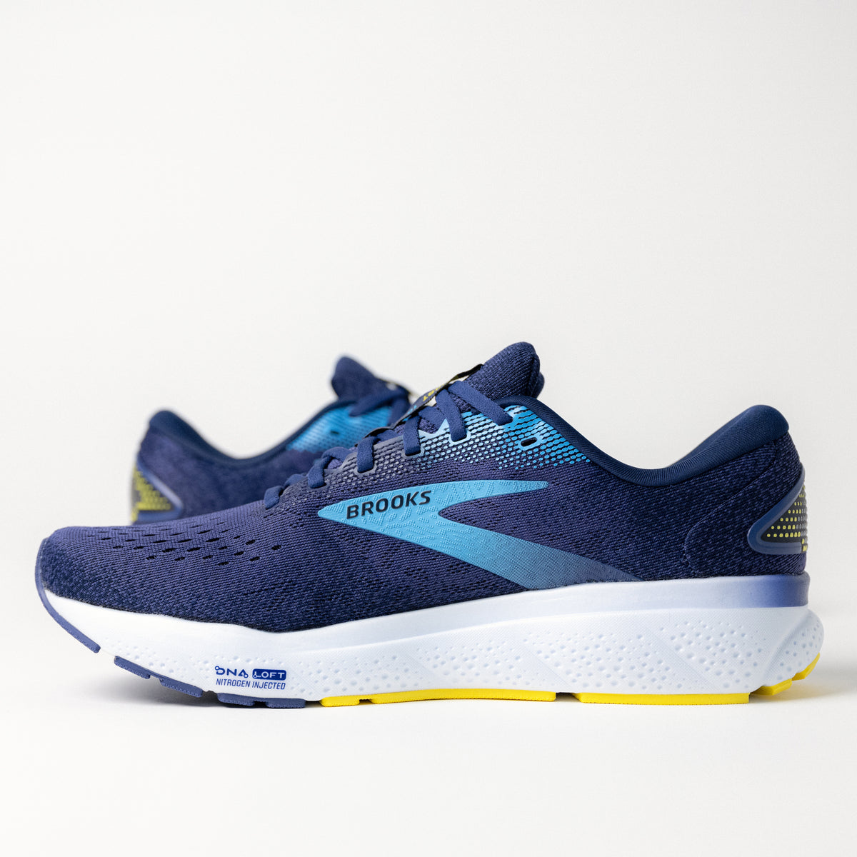 Side view of Men's Brooks Ghost 16 running shoe in Blue, showing the engineered mesh upper and smooth cushioning sole.