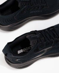 Close-up of Brooks Adrenaline GTS 25 logo and medial side detail – men’s stability running shoe in all-black colorway