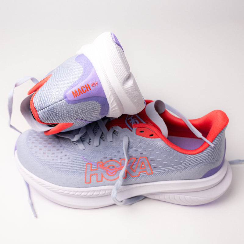 Close-up of Women's HOKA Mach 6 heel, showing Mach 6 logo and secure padded heel for a comfortable fit.