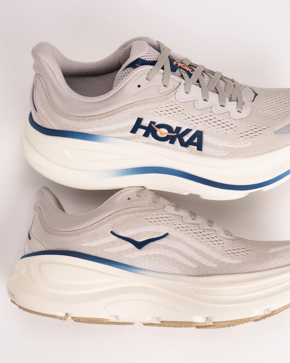 Heel profile of Men’s HOKA Bondi 9 in Stucco/Grout showing cushioned support design