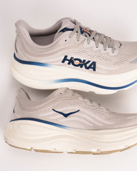 Heel profile of Men’s HOKA Bondi 9 in Stucco/Grout showing cushioned support design