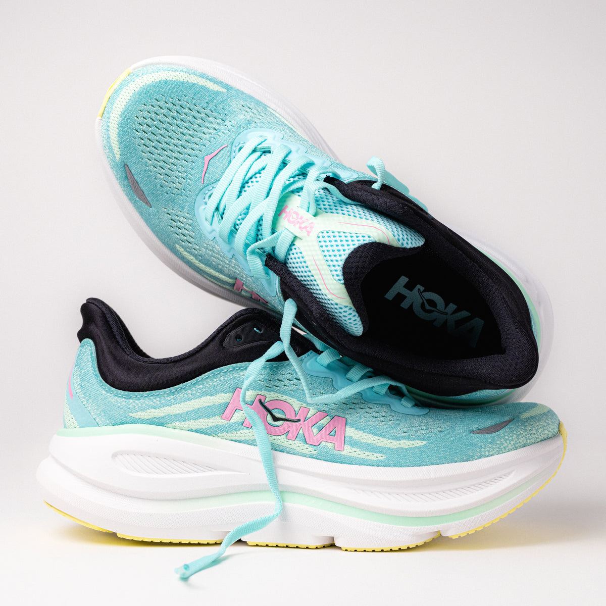 Detail side and top view of the Women's HOKA Bondi 9 Running Shoe in Blue Spark/Mint Fluorite/Green