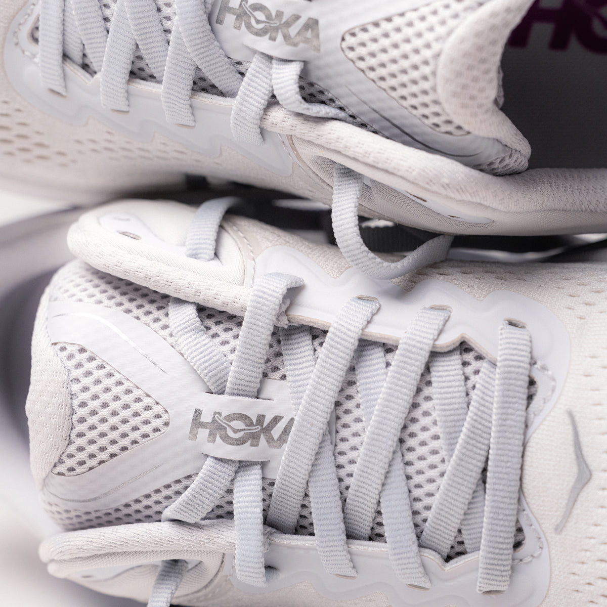 Close-up of the lacing detail and padded tongue on the HOKA Bondi 9 for women in Cosmic Grey/White