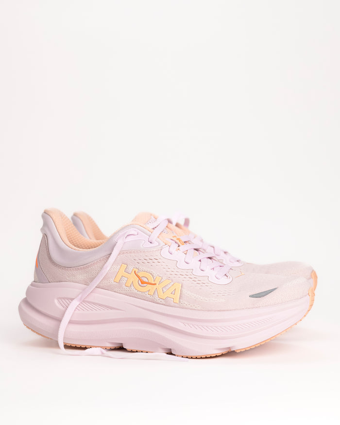 Women’s HOKA Bondi 9 – Max-Cushioned Running Shoe in Lilac Cream / Tangerine, Peachy Pink colorway with bright tangerine accents. 1162012-LRMT