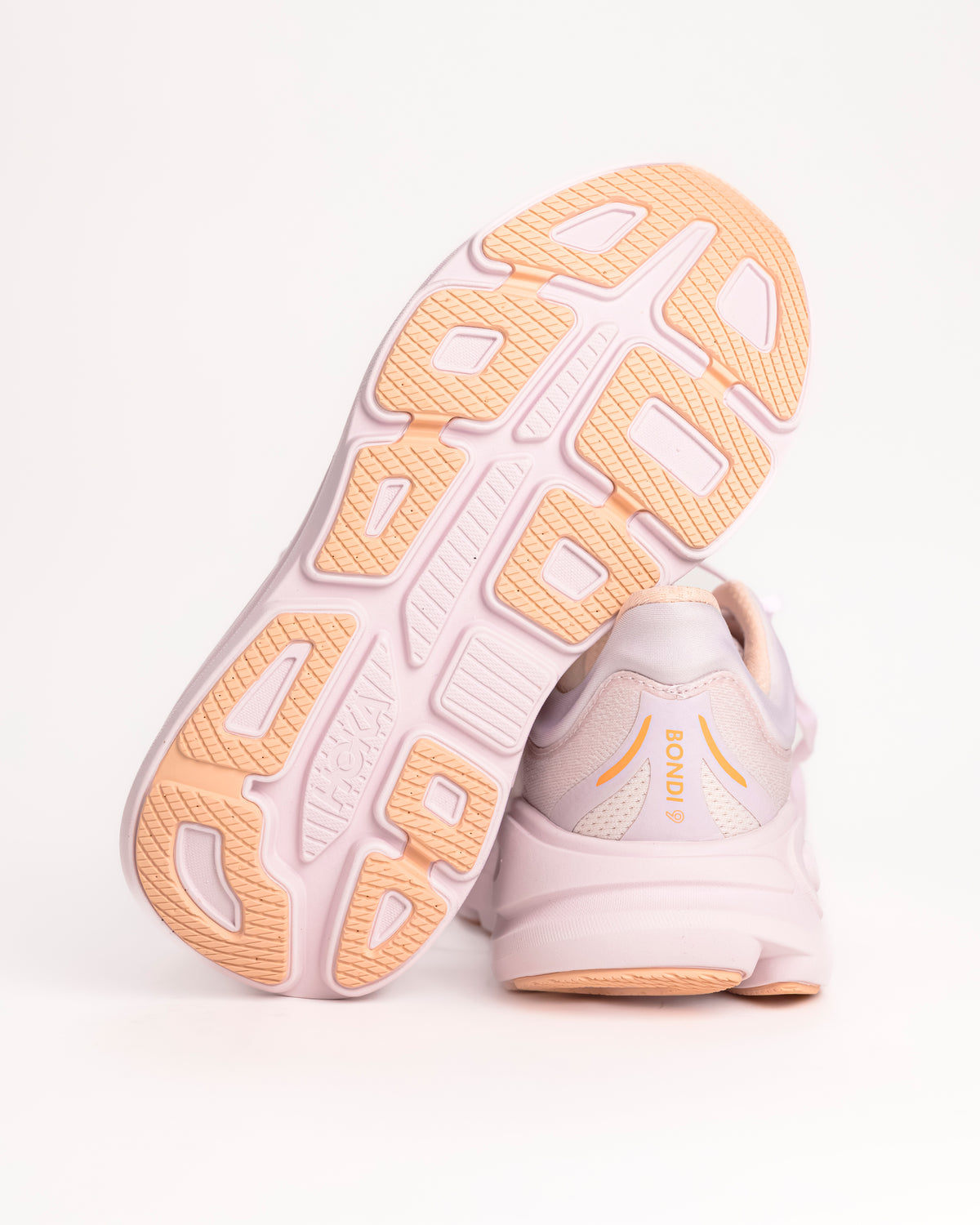 Women’s HOKA Bondi 9 – Max-Cushioned Running Shoe in Lilac Cream / Tangerine, Peachy Pink colorway with bright tangerine accents. 1162012-LRMT