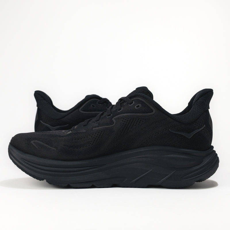 Black running shoes on a white background. 
Men's HOKA Clifton 10 Lightweight Running Shoe in All Black