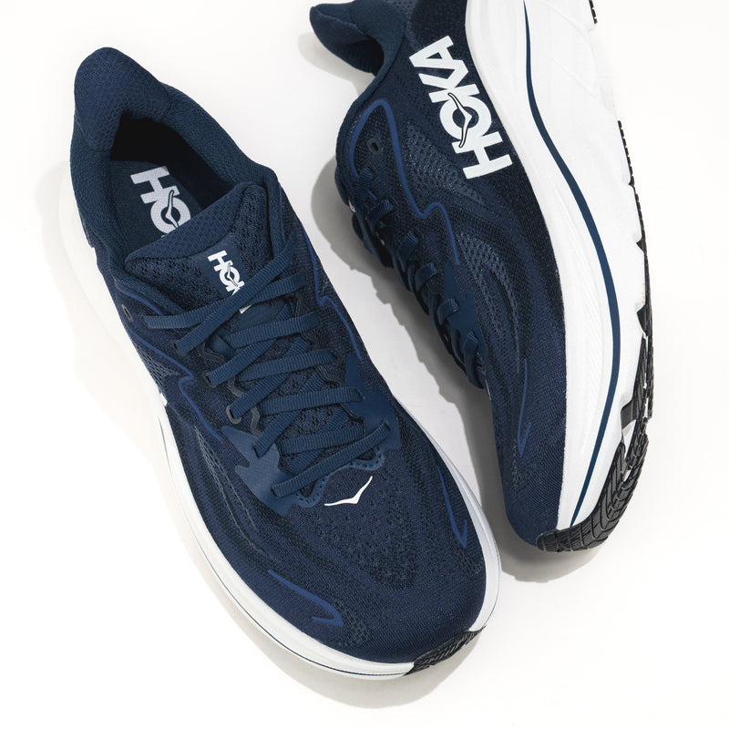 Navy running shoes with white soles and 'Hoka' branding on a white background.
Men's HOKA Clifton 10 Lightweight Running Shoe in Navy/White