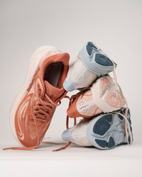 New colors of HOKA Clifton 10 running shoes for women stacked on each other on a white background