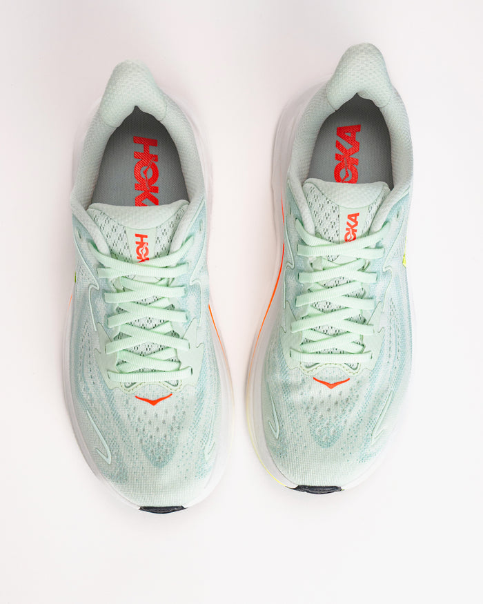 Women’s HOKA Clifton 10 in Sea Glass / Neon Flame Lightweight Running Shoes with orange accents on a white background