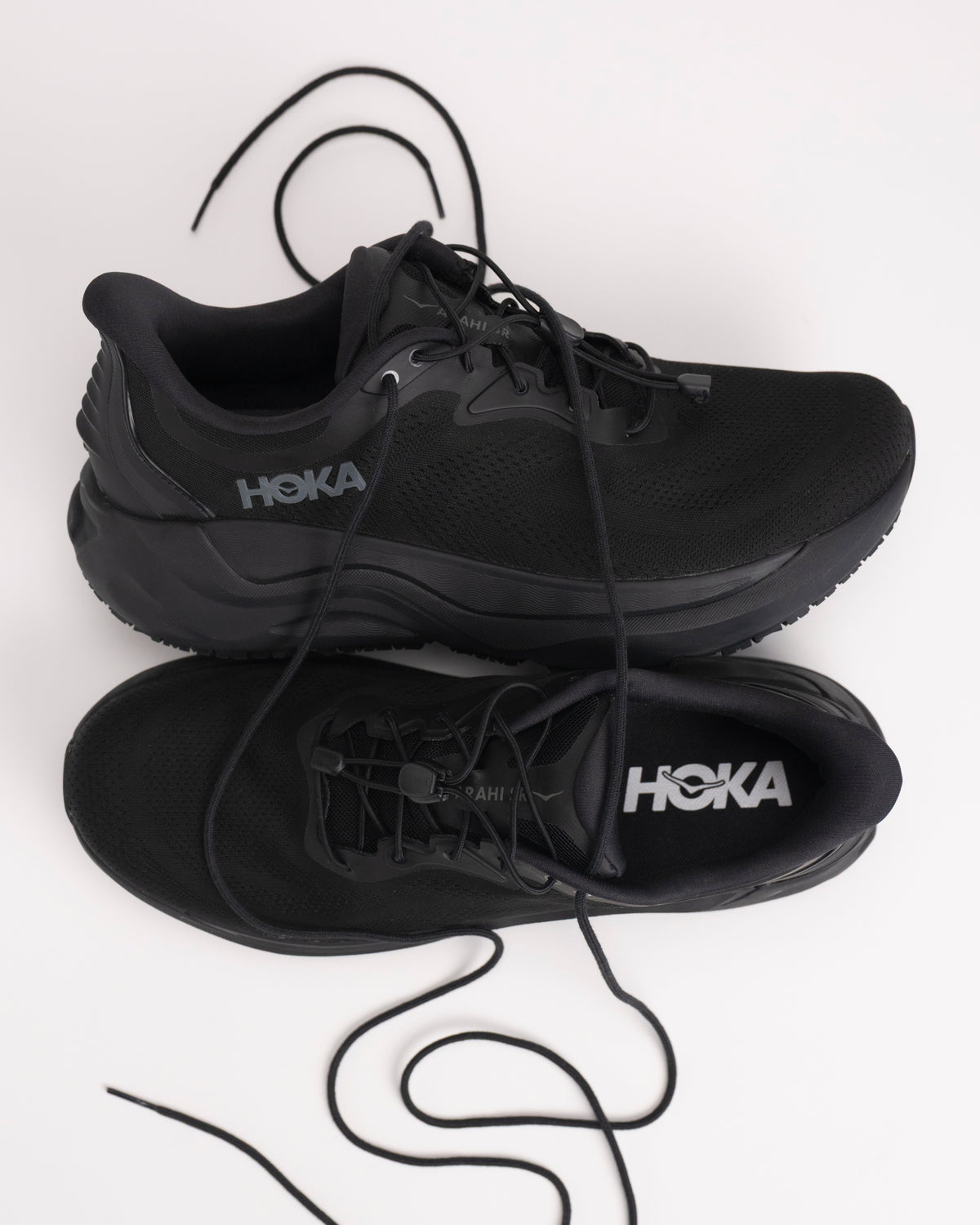 Black HOKA Arahi SR water-resistant slip-resistant durable shoes with both toggle lace closure and traditional lace design.