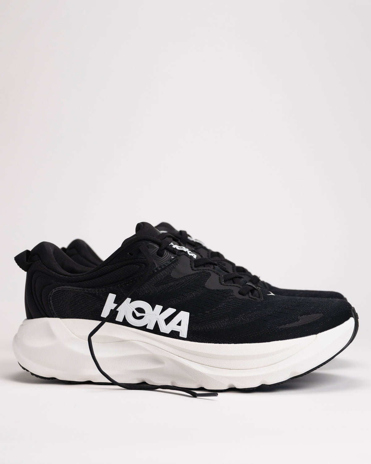 Side view of Men’s HOKA Gaviota 6 in Black/White showing enhanced H-Frame™ stability structure