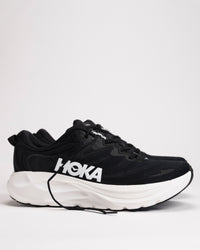 Side view of Men’s HOKA Gaviota 6 in Black/White showing enhanced H-Frame™ stability structure