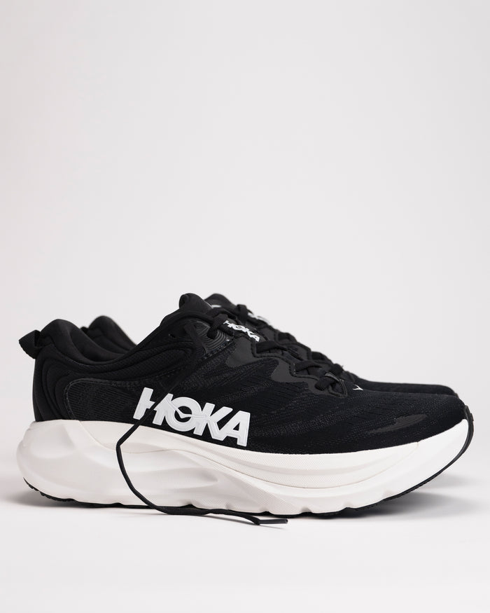 Side view of Men’s HOKA Gaviota 6 in Black/White showing enhanced H-Frame™ stability structure