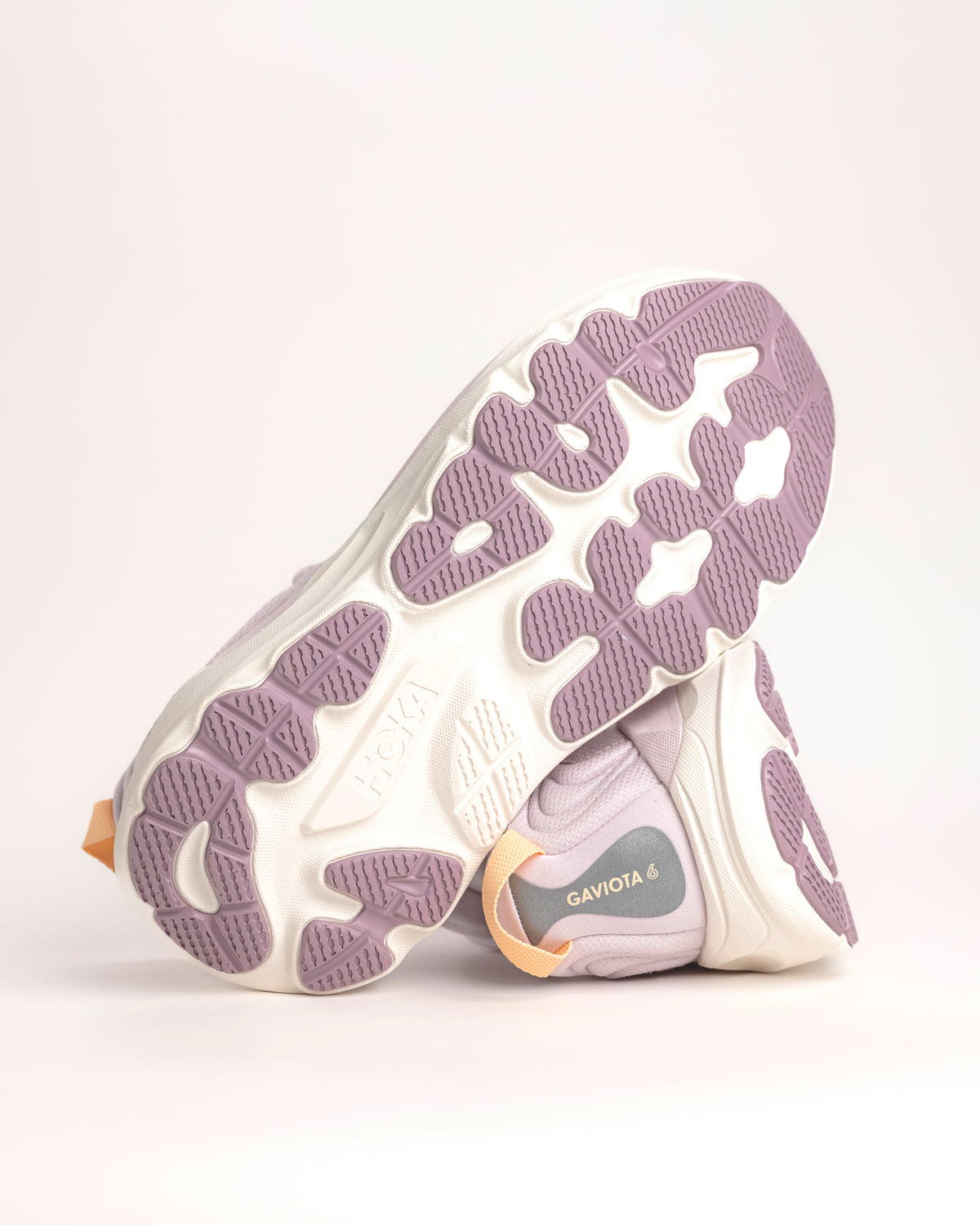 The Women’s HOKA Gaviota 6 is designed for runners and walkers who want dependable stability paired with plush, confidence-building comfort. Built on a broad, cushioned platform, this supportive road running shoe delivers a smooth, balanced ride that feels steady underfoot without feeling stiff or restrictive. Lilac Cream / Fragrant Lilac