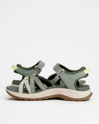 Women’s Teva Tirra Sport Hiking Sandal - Modernized Trail Comfort in Seagrass / Green with Spider Rubber outsole for grip on wet surfaces. Quick dry webbing straps with hook and loop adjustment and extra padding on high-friction areas. Superior arch support.