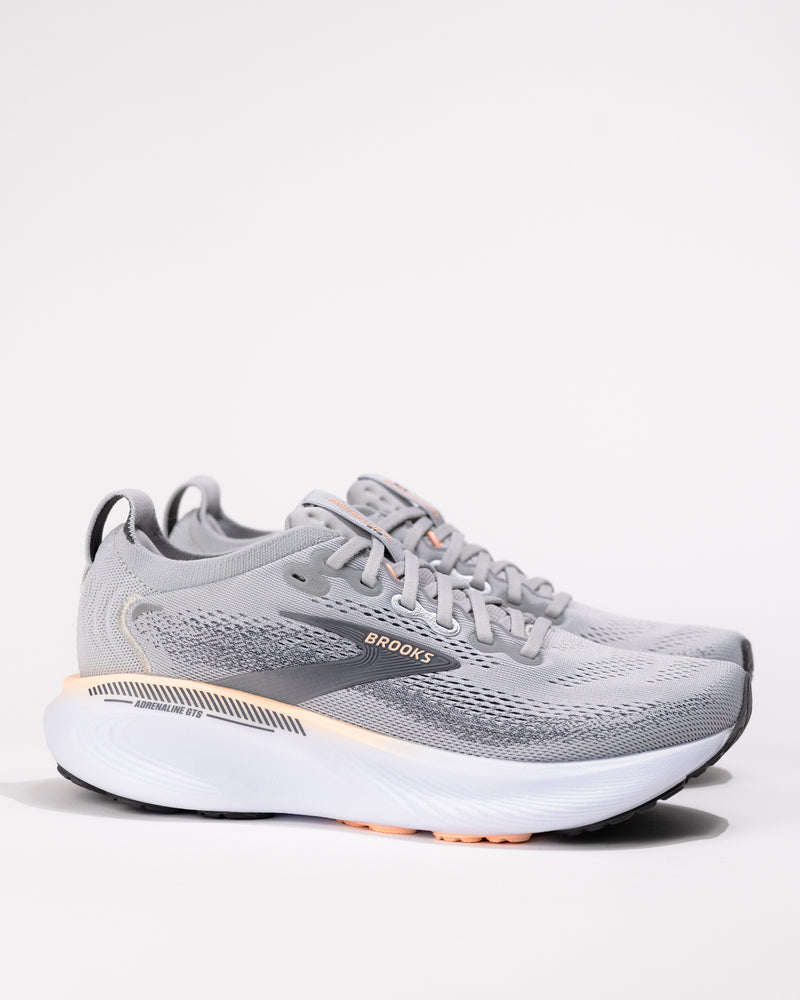 Women’s Brooks Adrenaline GTS 25 in Grey/Coral – medial side showing breathable mesh upper and GuideRails® support system