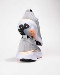 Rear view of Brooks Adrenaline GTS 25 in Grey/Coral highlighting heel counter stability and upper detail texture