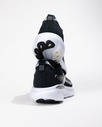 Rear view of Brooks Adrenaline GTS 25 in Black/White highlighting heel counter stability and upper texture