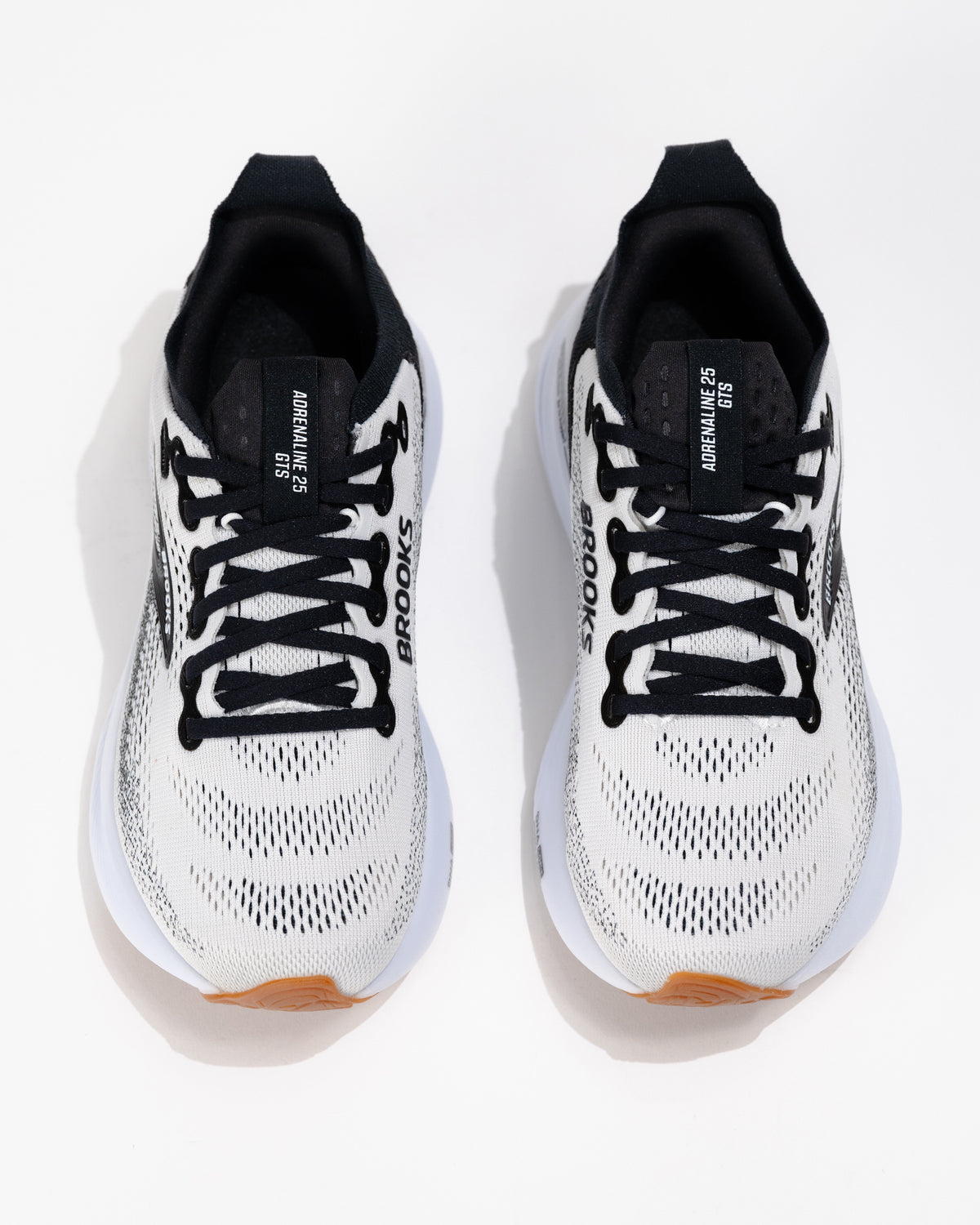 Top-down view of Brooks Adrenaline GTS 25 running shoes showing laced black tongue, breathable mesh upper, and cushioned collar.