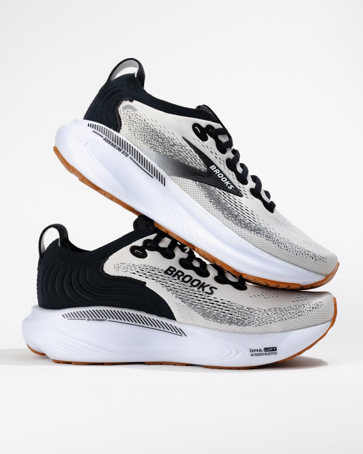 Stylized pair of Adrenaline GTS 25s layered to show side profile and heel drop, emphasizing responsive cushioning and stability.