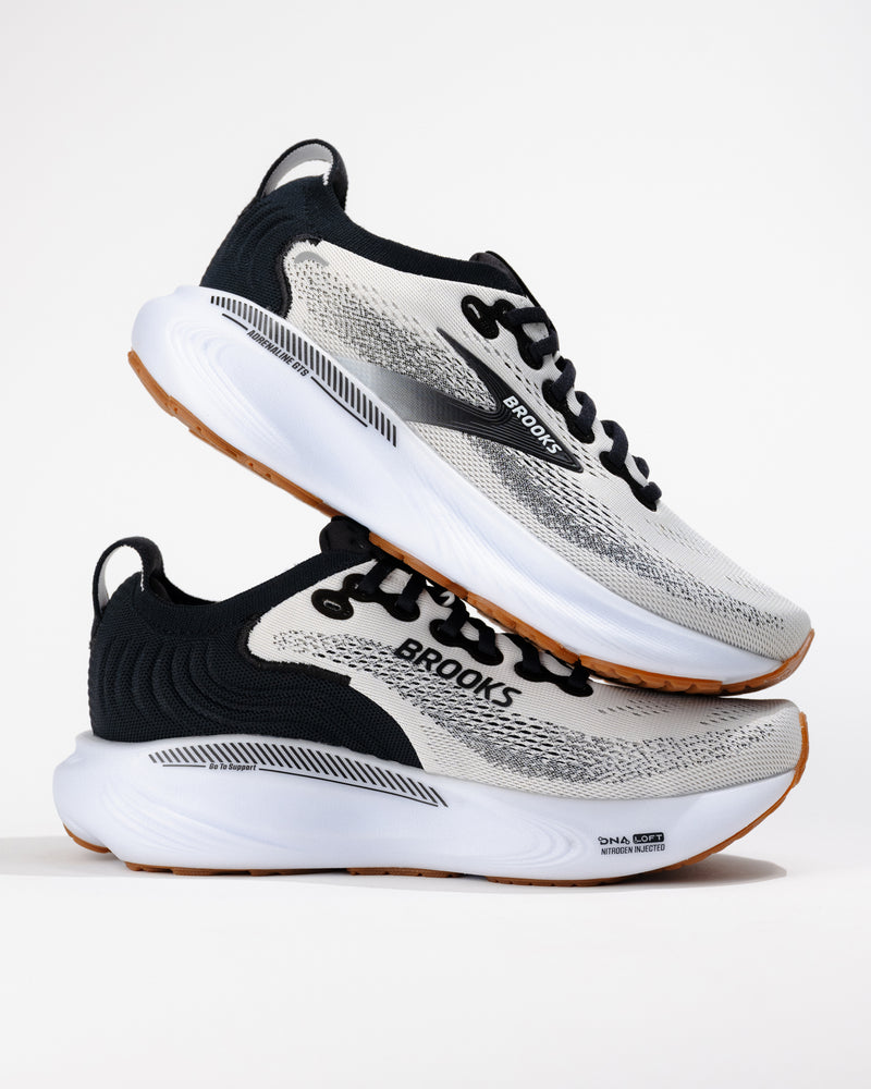 Stylized pair of Adrenaline GTS 25s layered to show side profile and heel drop, emphasizing responsive cushioning and stability.