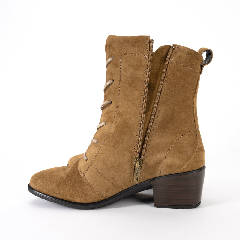 Zipper detail view of the Majesty Mid-Calf Boot by Naot with functioning zipper for an adjustable fit. Soft sueded leather and natural cork and latex removable footbed.