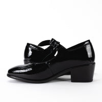 Side view of the Nobility Mary Jane shoe in black patent leather, showing the low, block heel and the slightly curved silhouette of the shoe.