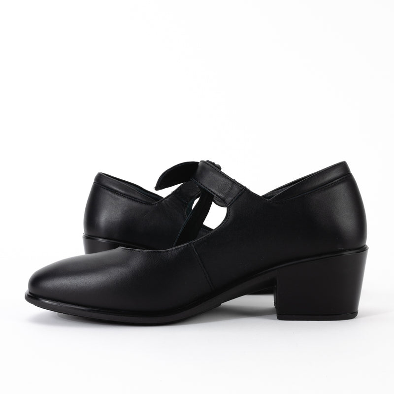 Side view of the Nobility Mary Jane shoe in black smooth leather, showing the low, block heel and the slightly curved silhouette of the shoe.