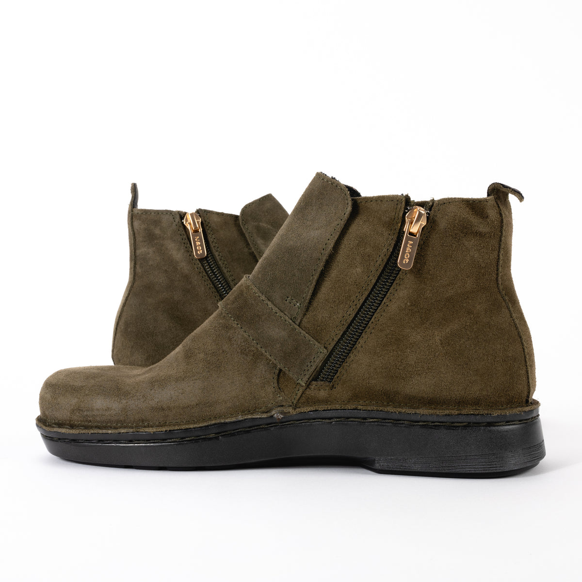 Side detail view of the Kolmer Ankle Boot from Naot in sueded leather featuring an easy-on functional zipper and slip-resistant sole. 