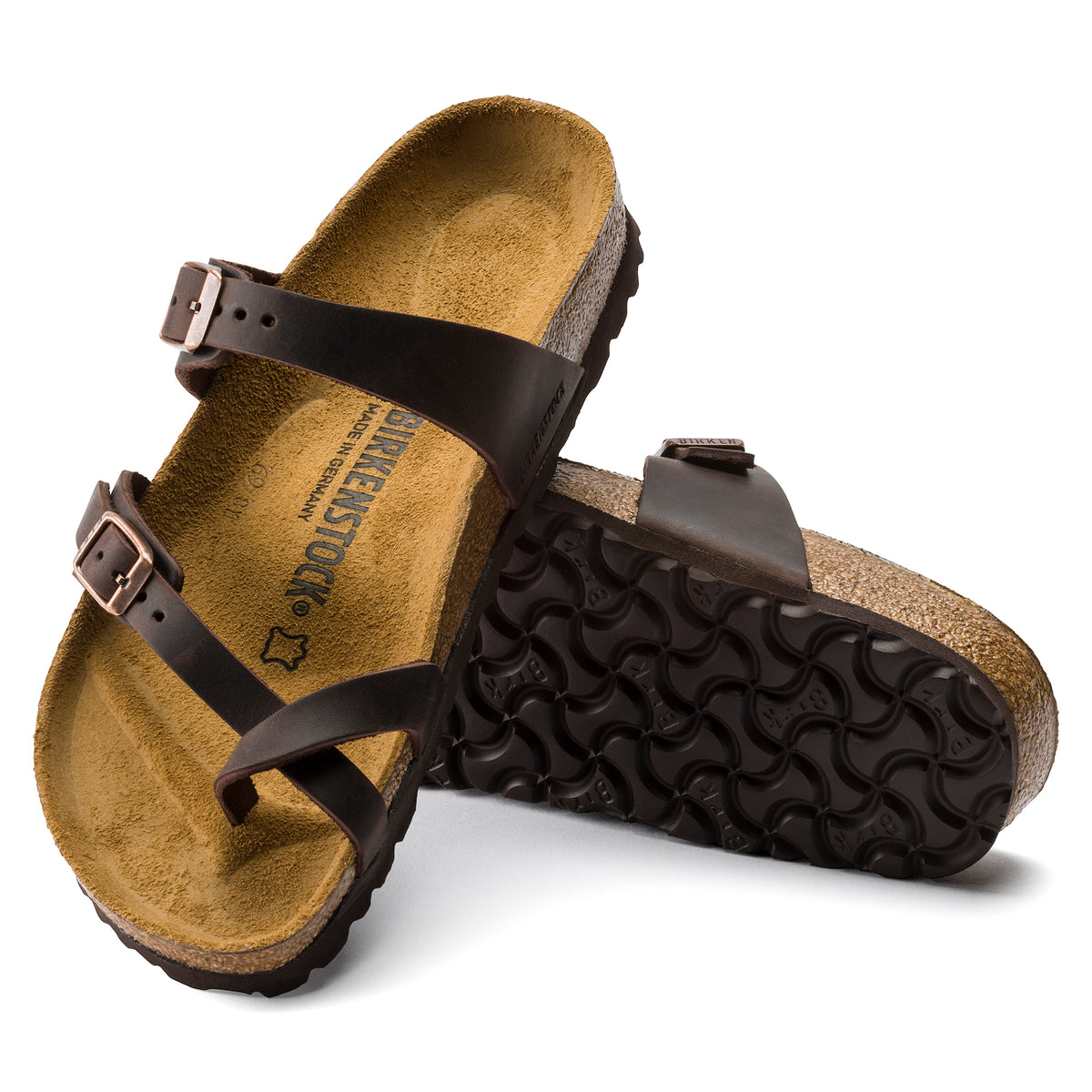 Detail view of the Original cork-latex Birkenstock footbed and adjustable leather straps on the Women's Birkenstock Mayari Slip-On Sandal in Habana Oiled Leather