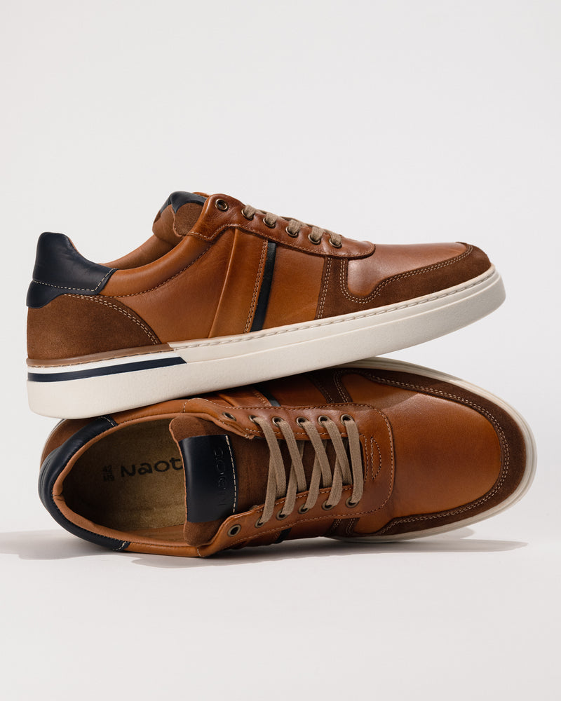 Orthotic-friendly removable footbed with cushion and arch support and plush padded tongue in the Brown/Navy  Naot Swift.