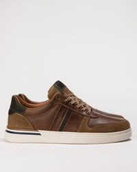 Clean side profile highlighting the tri-color leather upper and low-profile sole of the Naot Swift sneaker.