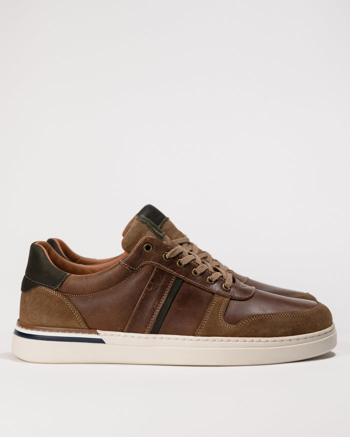 Clean side profile highlighting the tri-color leather upper and low-profile sole of the Naot Swift sneaker.
