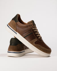 Side shot emphasizing the stacked heel and padded collar.