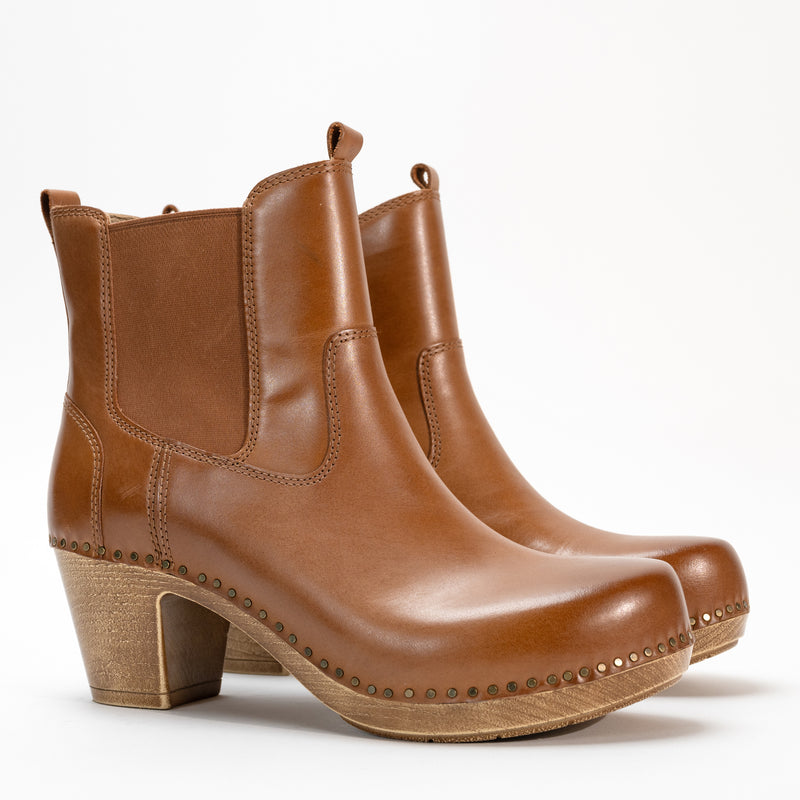 Side view of the Dansko Shayna heeled boot in premium full-grain leather with nail-head details and an inside zipper.