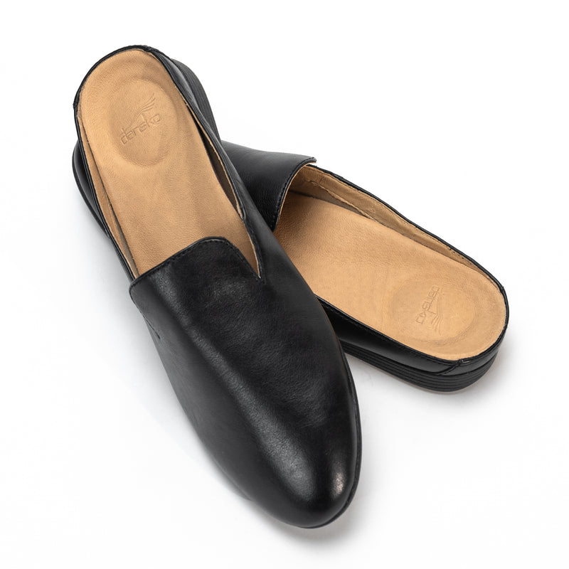 Detailed view of the stylish Dansko Lexie slip-on mule with a removable EVA footbed and Dansko Natural Arch® technology.