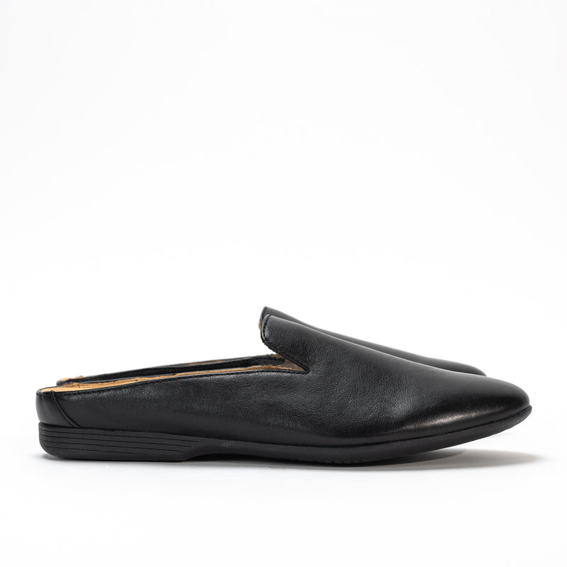 Side profile of Dansko Lexie mule in black smooth leather, highlighting sleek design and low heel.