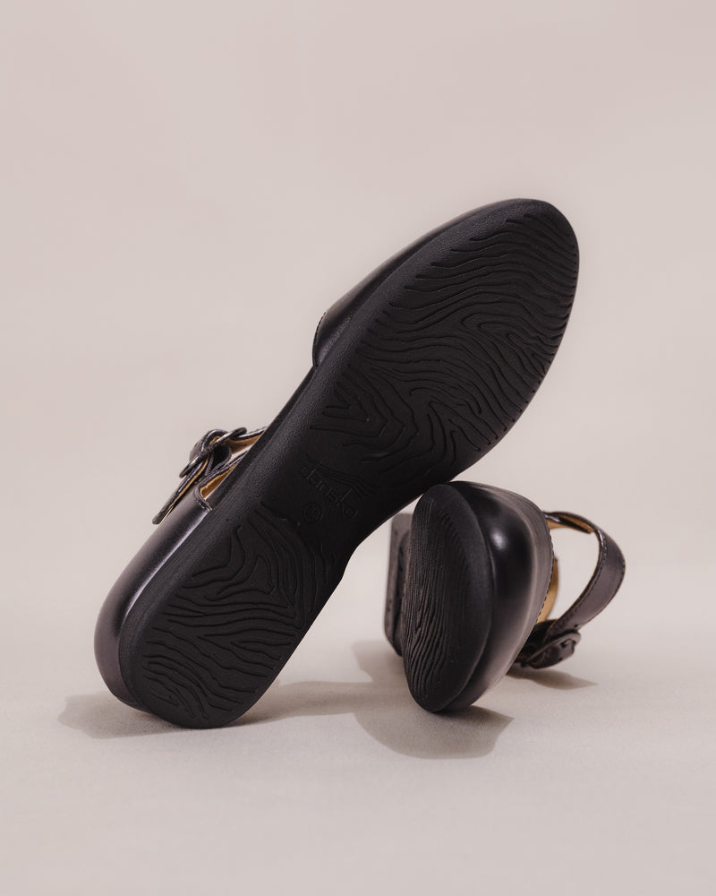 Bottom view of the shoe showing the textured rubber outsole and tread pattern for grip.