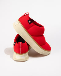 Close-up of the side and heel showing layered puffy design and outsole texture.