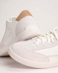 White Men’s SOREL Ona Drift Sneaker in Sea Salt with a tan heel on a light background