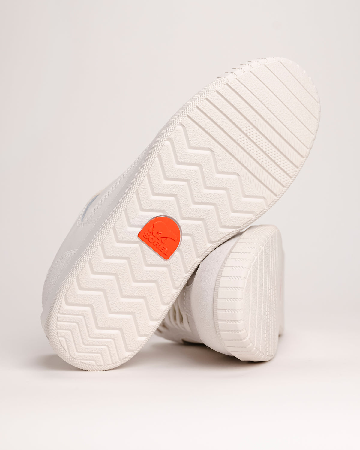 Rubber outsole detail of Men’s SOREL Ona Drift sneaker on white background