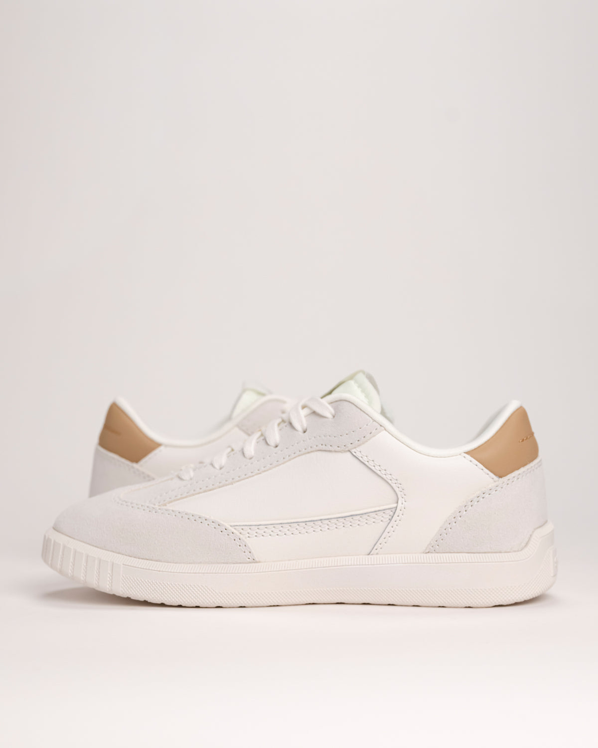 Pair of Women’s SOREL Ona Drift sneakers in Sea Salt white on white background