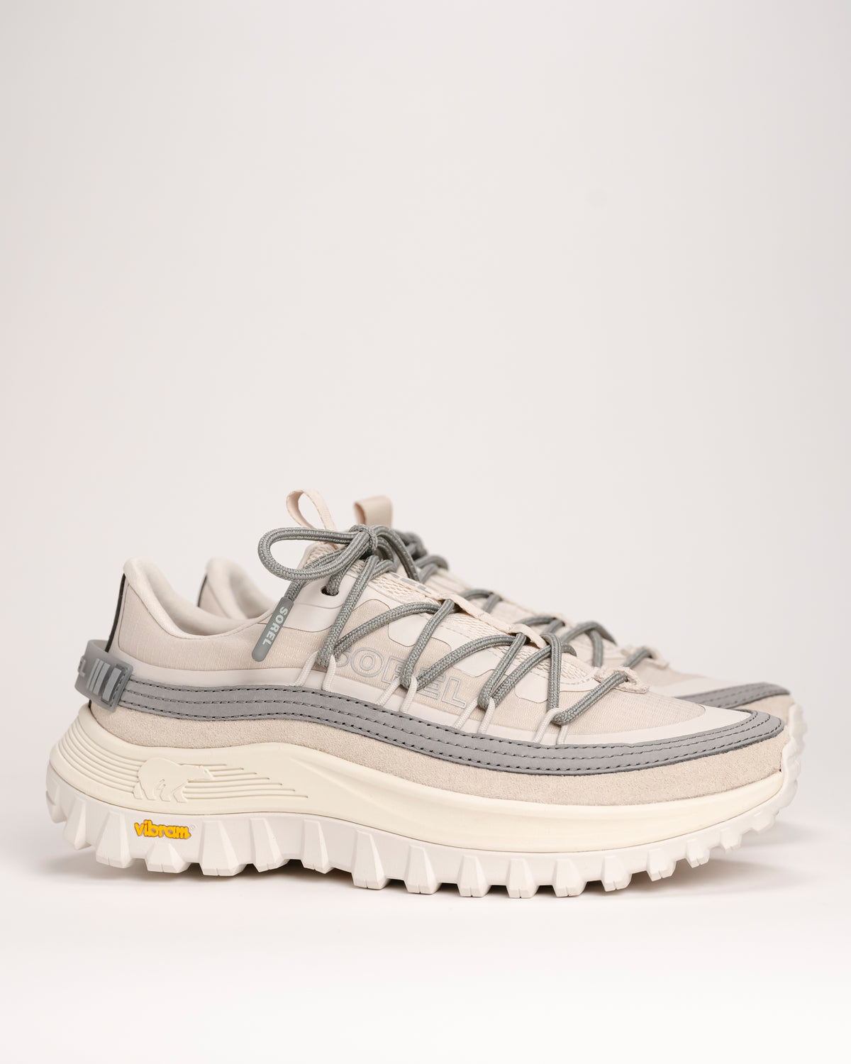 White and gray SOREL Callsign Horizon™ Low Sneaker in Fawn / Chrome Grey on a light background