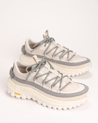 Pair of white and gray SOREL Callsign Horizon™ Low Sneaker in Fawn / Chrome Grey on a light background