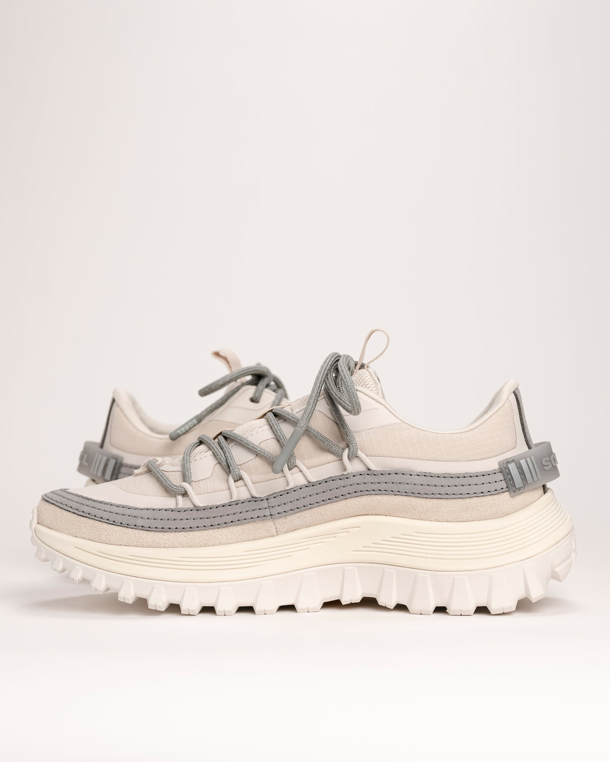 White and gray SOREL Callsign Horizon Low sneakers on a white background