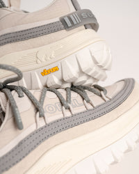 Close-up of the SOREL Callsign Horizon™ Low Sneaker in Fawn / Chrome Grey with gray accents and Vibram branding.
