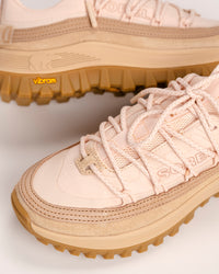 Pair of pink SOREL Callsign Horizon™ Low trail shoes with tan soles on a light background