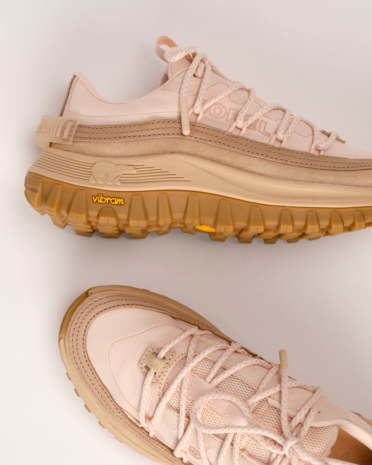 SOREL Callsign Horizon™ Low women's sneakers with brown Vibram slip-resistant soles on a light background